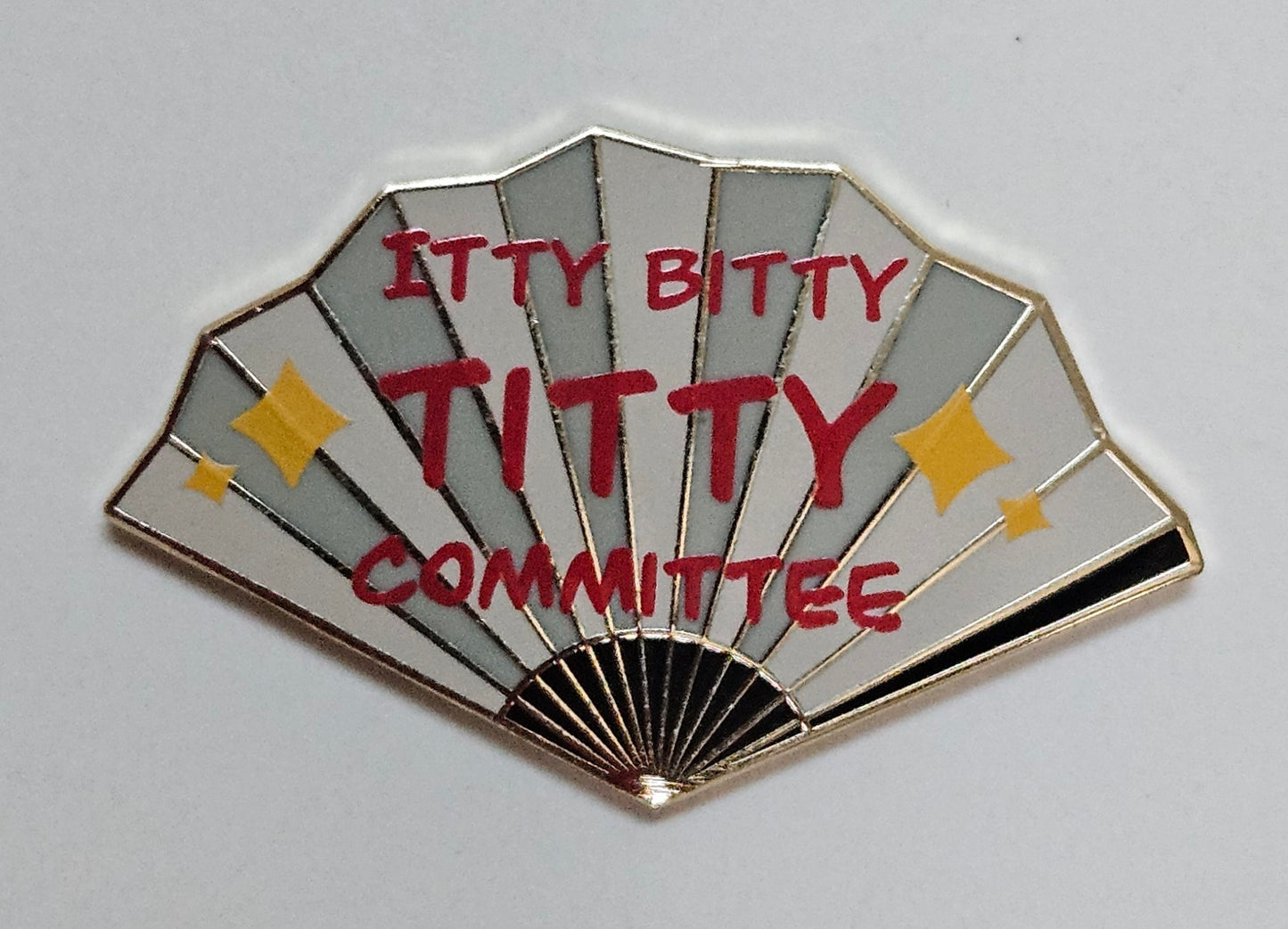 "Itty Bitty Titty Committee" filler fan pin